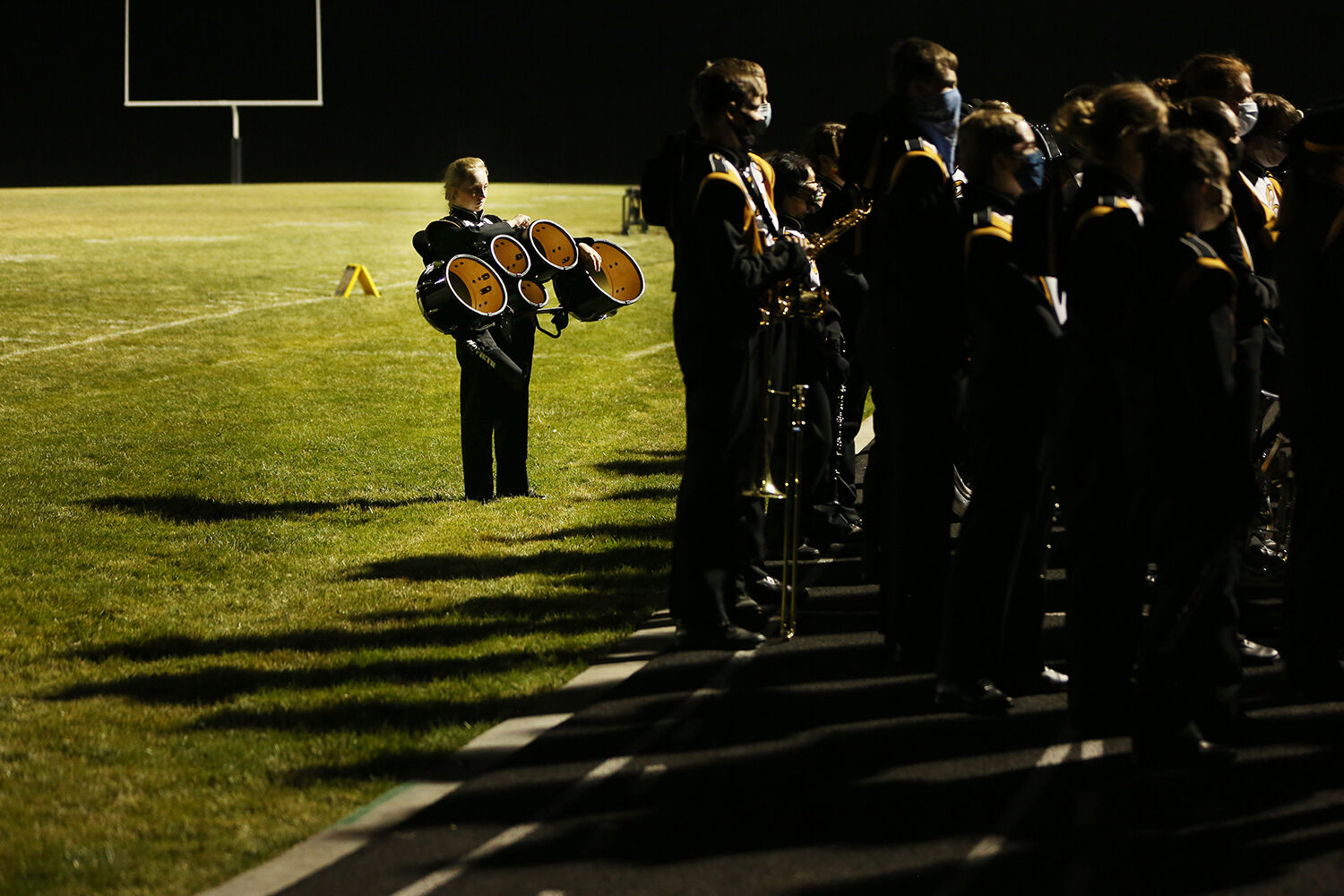 Sage Palser stands behind the band with her quints